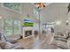 Spacious living room with a cozy fireplace, and views into the modern kitchen at 131 Banyon Ct, Dallas, GA 30157