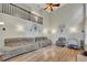Bright living room featuring high ceilings, wood floors, and comfortable seating at 131 Banyon Ct, Dallas, GA 30157