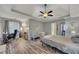 Spacious primary bedroom with plenty of room, wood-look flooring, and a walk-in closet at 131 Banyon Ct, Dallas, GA 30157