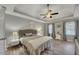The main bedroom is filled with natural light, plenty of space, and wood-look flooring at 131 Banyon Ct, Dallas, GA 30157