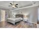 Large primary bedroom features plenty of space, natural light, and a modern ceiling fan at 131 Banyon Ct, Dallas, GA 30157