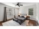 Inviting bedroom with windows, hardwood floors, ceiling fan, and cozy neutral décor at 2240 Cheshire Bridge Ne Rd # 206, Atlanta, GA 30324