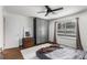 Bedroom with hardwood floors, a window, grey wardrobe, and rustic trunk at 2240 Cheshire Bridge Ne Rd # 206, Atlanta, GA 30324