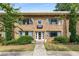 Charming stone building with a beautiful front entrance and well-maintained landscaping at 2240 Cheshire Bridge Ne Rd # 206, Atlanta, GA 30324