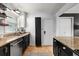Well-lit kitchen featuring granite countertops, stainless steel appliances, white subway tile, and wood floors at 2240 Cheshire Bridge Ne Rd # 206, Atlanta, GA 30324