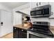 Kitchen featuring stainless steel oven and microwave, granite countertops, and white subway tile backsplash at 2240 Cheshire Bridge Ne Rd # 206, Atlanta, GA 30324