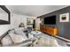 Well-lit living room with large TV, comfortable furniture, and modern design at 2240 Cheshire Bridge Ne Rd # 206, Atlanta, GA 30324
