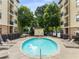 Relaxing community pool area with lounge chairs and lush greenery at 2240 Cheshire Bridge Ne Rd # 206, Atlanta, GA 30324