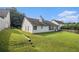 This backyard features a lush, grassy lawn and an attractive, fenced perimeter at 2397 Cove Lake Rd, Lithonia, GA 30058