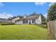 The expansive backyard with lush grass offers space and outdoor enjoyment at 2397 Cove Lake Rd, Lithonia, GA 30058