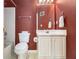 A half bathroom featuring a single sink vanity, and a toilet at 2397 Cove Lake Rd, Lithonia, GA 30058