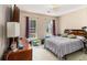 Bedroom with carpet, natural light from windows, and classic dresser at 2397 Cove Lake Rd, Lithonia, GA 30058