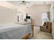 Spacious bedroom with a ceiling fan, large windows, and plenty of natural light at 2397 Cove Lake Rd, Lithonia, GA 30058