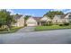 A single-story home with a well-manicured lawn, two car garage, and classic suburban appeal at 2397 Cove Lake Rd, Lithonia, GA 30058