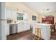 Kitchen with island and updated appliances, offers seating and storage space at 2397 Cove Lake Rd, Lithonia, GA 30058