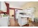 Functional kitchen with white cabinets, central island, and access to other rooms at 2397 Cove Lake Rd, Lithonia, GA 30058