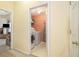 This laundry room is equipped with a washer, dryer, and shelving for storage at 2397 Cove Lake Rd, Lithonia, GA 30058