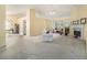 Spacious living room includes a fireplace, ceiling fan, and an open doorway to another room at 2397 Cove Lake Rd, Lithonia, GA 30058