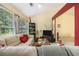 Bright living room featuring large window, comfortable seating, and open floor plan at 2397 Cove Lake Rd, Lithonia, GA 30058