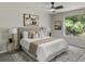Calming main bedroom featuring contemporary decor, soft carpeting, and a large window at 4912 Bayside Ct, Stone Mountain, GA 30088