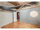 Bedroom features wood floors, exposed beams, and a closet at 63 Mangum Sw St # 3, Atlanta, GA 30313