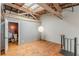 Bedroom featuring wood floors, exposed beams, and an ensuite bathroom at 63 Mangum Sw St # 3, Atlanta, GA 30313