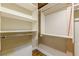 Walk-in closet with wood floors and white shelving and racks for plenty of storage at 63 Mangum Sw St # 3, Atlanta, GA 30313