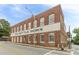Charming brick building featuring 'The Bottle Works' sign along a cracked street at 63 Mangum Sw St # 3, Atlanta, GA 30313