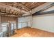 Spacious living room featuring hardwood floors, brick walls, and a wooden ceiling with exposed beams at 63 Mangum Sw St # 3, Atlanta, GA 30313