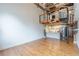 Spacious living room featuring hardwood floors, exposed wood beams, and a spiral staircase at 63 Mangum Sw St # 3, Atlanta, GA 30313