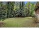 The back yard provides a peaceful, private setting enhanced by the surrounding mature trees at 1206 Tuckawanna Sw Dr, Atlanta, GA 30311