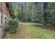View of backyard showcasing lots of space in a serene, wooded environment at 1206 Tuckawanna Sw Dr, Atlanta, GA 30311