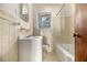 This vintage bathroom features a built-in tub and shower, a window, and classic tile at 1206 Tuckawanna Sw Dr, Atlanta, GA 30311