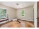 This bedroom has hardwood floors, two windows, and a doorway at 1206 Tuckawanna Sw Dr, Atlanta, GA 30311