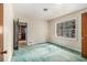 Bedroom features a window and doorway and green carpeting at 1206 Tuckawanna Sw Dr, Atlanta, GA 30311