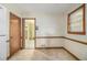 Traditional kitchen with a window and view to the adjacent room provides classic appeal at 1206 Tuckawanna Sw Dr, Atlanta, GA 30311