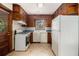This kitchen features a gas range, plenty of wood cabinetry, and natural light at 1206 Tuckawanna Sw Dr, Atlanta, GA 30311