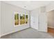 Inviting bedroom with plush carpet, a large window with scenic views, and a spacious double-door closet at 1991 Deco Dr, Kennesaw, GA 30144