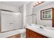 Clean bathroom featuring a shower-tub combination and a vanity with ample counter space at 2419 Anderson Mill Rd, Austell, GA 30106