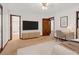 Spacious bedroom with a view of the bath, desk, and a large flat screen TV at 2419 Anderson Mill Rd, Austell, GA 30106