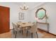 Bright dining room featuring modern lighting, table with seating for six, and a unique window at 2419 Anderson Mill Rd, Austell, GA 30106