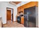 Classic kitchen features updated appliances, wood cabinets, and stylish hardwood-style flooring at 2419 Anderson Mill Rd, Austell, GA 30106
