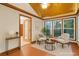 Cozy sun room with light filled windows and comfortable seating at 2419 Anderson Mill Rd, Austell, GA 30106