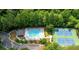 Aerial view of community pool, tennis court, and lush landscaping at 3520 Mystic Dr, Buford, GA 30519