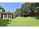 Expansive backyard featuring lush greenery and peaceful outdoor space at 3520 Mystic Dr, Buford, GA 30519