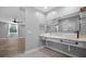 Modern bathroom boasts dual sinks, granite counters, and wood floors at 3520 Mystic Dr, Buford, GA 30519