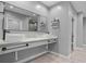 Modern bathroom featuring dual sinks, granite counters, and ample storage at 3520 Mystic Dr, Buford, GA 30519