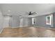 Expansive living room with recessed lights, ceiling fan, and wood floors at 3520 Mystic Dr, Buford, GA 30519