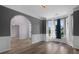 Inviting living room with bay window, wood flooring, and neutral wall color at 3520 Mystic Dr, Buford, GA 30519