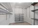 Organized walk-in closet with shelves, hanging rods, and storage bins at 3520 Mystic Dr, Buford, GA 30519